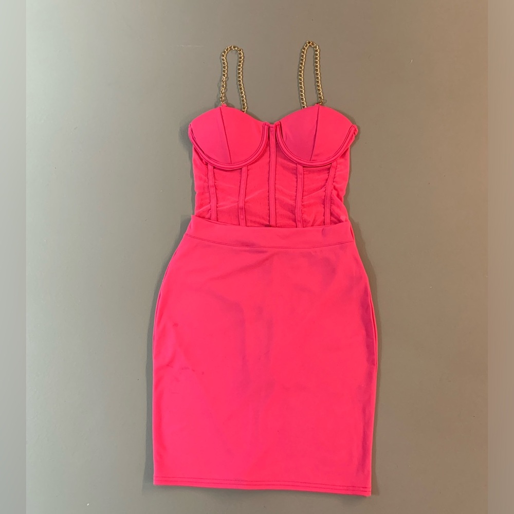 Bright pink 2 piece outfit dress - bodysuit and skirt with gold chain straps.